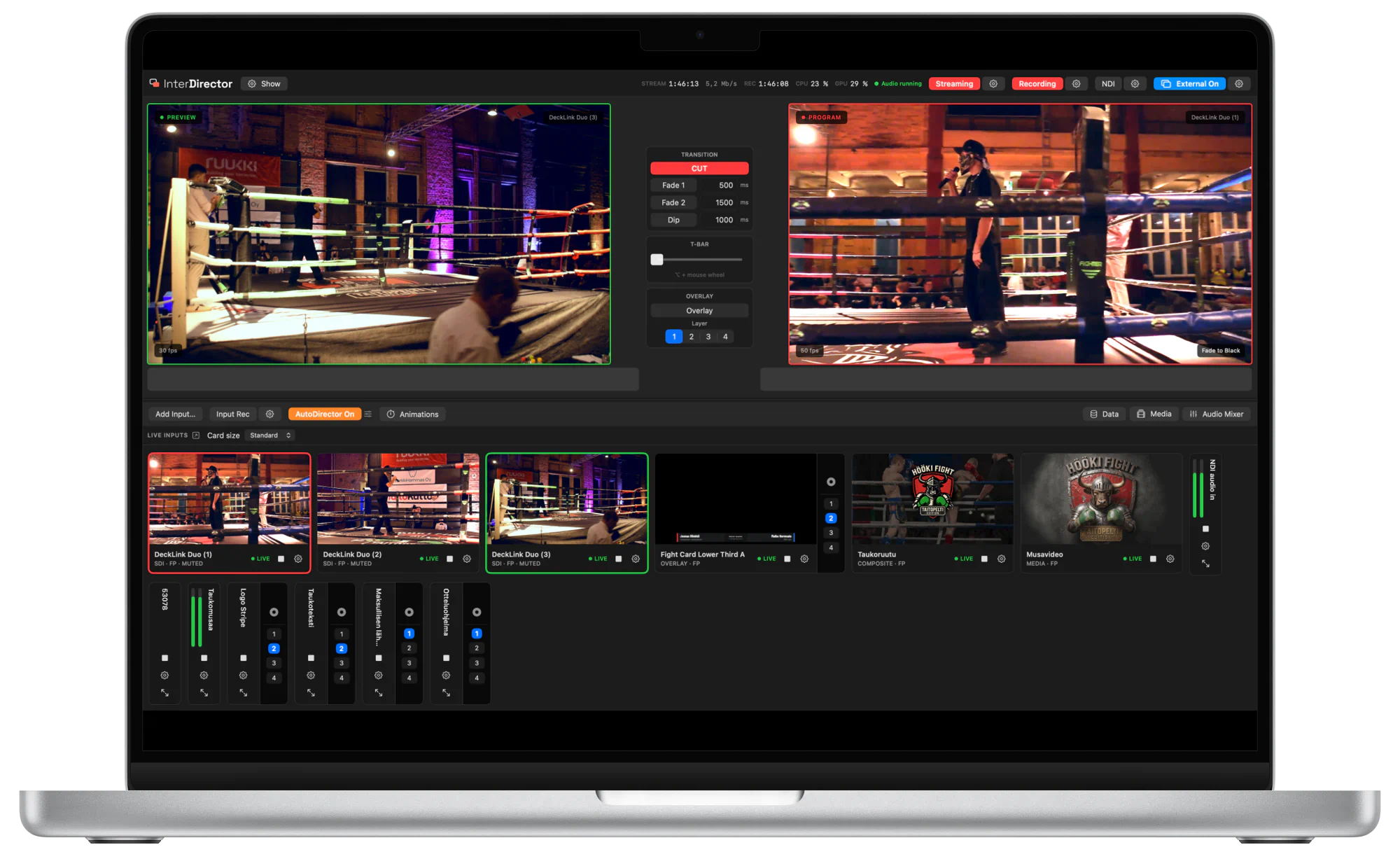 InterDirector’s operator window on a MacBook: Preview and Program monitors side by side above a row of live input cards.